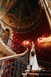 Photo of a bride at grand staircase of St Pancras Renaissance Hotel