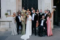 relaxed wedding group photo outside andaz hotel in london