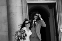 bride and groom with sunglasses, laughing at their beckenham place wedding day