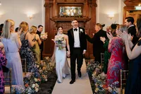 bride and groom exiting bishopsgate ceremony room andaz hotel smiling