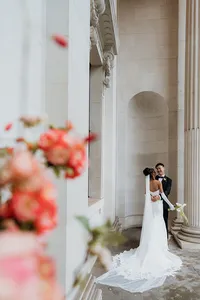 editorial wedding portrait of a couple hugging at old marylebone town hall colonnade
