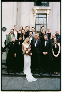 modern analogue wedding photo of bridal party in black - winter wedding captured on 35mm film