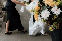 creative detail photo of bride and bridemsaids shoes entering marylebone town hall