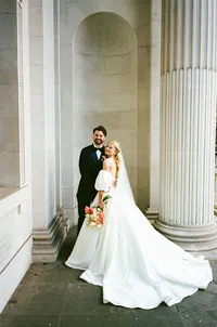 35mm film wedding photography of a couple at old marylebone town hall steps
