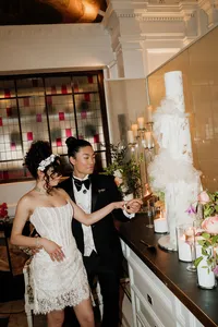 bride and groom cutting a wedding cake at andaz hotel in london