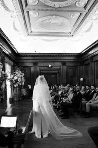 nostalgic cinematic natural photo of bride in westminster room with dramatic light