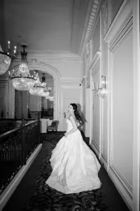 creative photos of bride running away in Mandarin oriental hotel hall