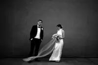 creative modern wedding photo with bride and groom standing away from each other in black and white andaz wedding