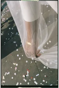 close up photo of bridal hand and veil captured on 35mm film