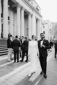 nostalgic black and white candid portrait of bride and groom outside the old marylebone town hall