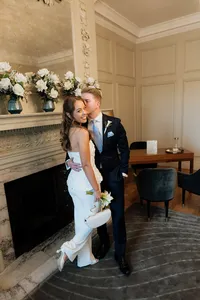 groom kissing bride in soho room of marylebone town hall