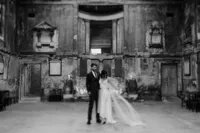 Nostalgic blurry wedding photography of bride and groom in decaying asylum chapel
