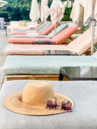 hat-on-top-of-lounge-chair