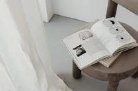 kaboompics_grey-beige-upholstered-dining-chair-open-books-greige-26608