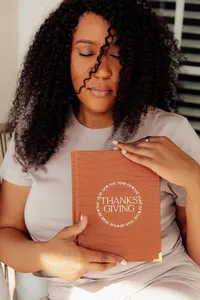 woman holding her journal