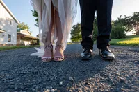 Close up of the feet of a newlywed couple