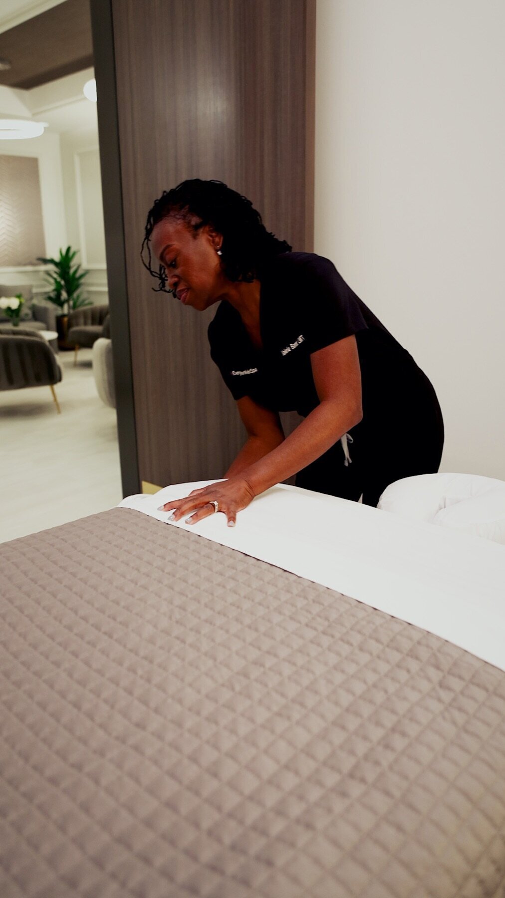 Team member preparing a treatment bed