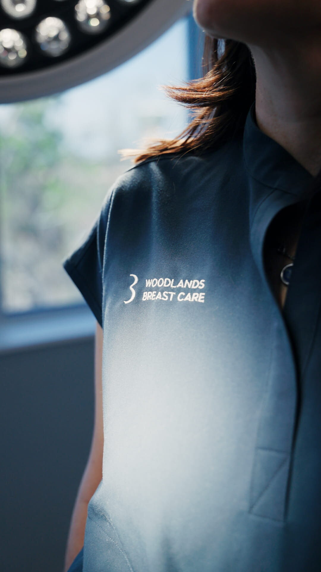 Back of a surgeon’s scrub top in the operating room