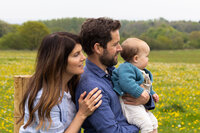 fallback shared on Invalid Date | Family of three enjoying a tranquil meadow, with a focus on togetherness and the simple 