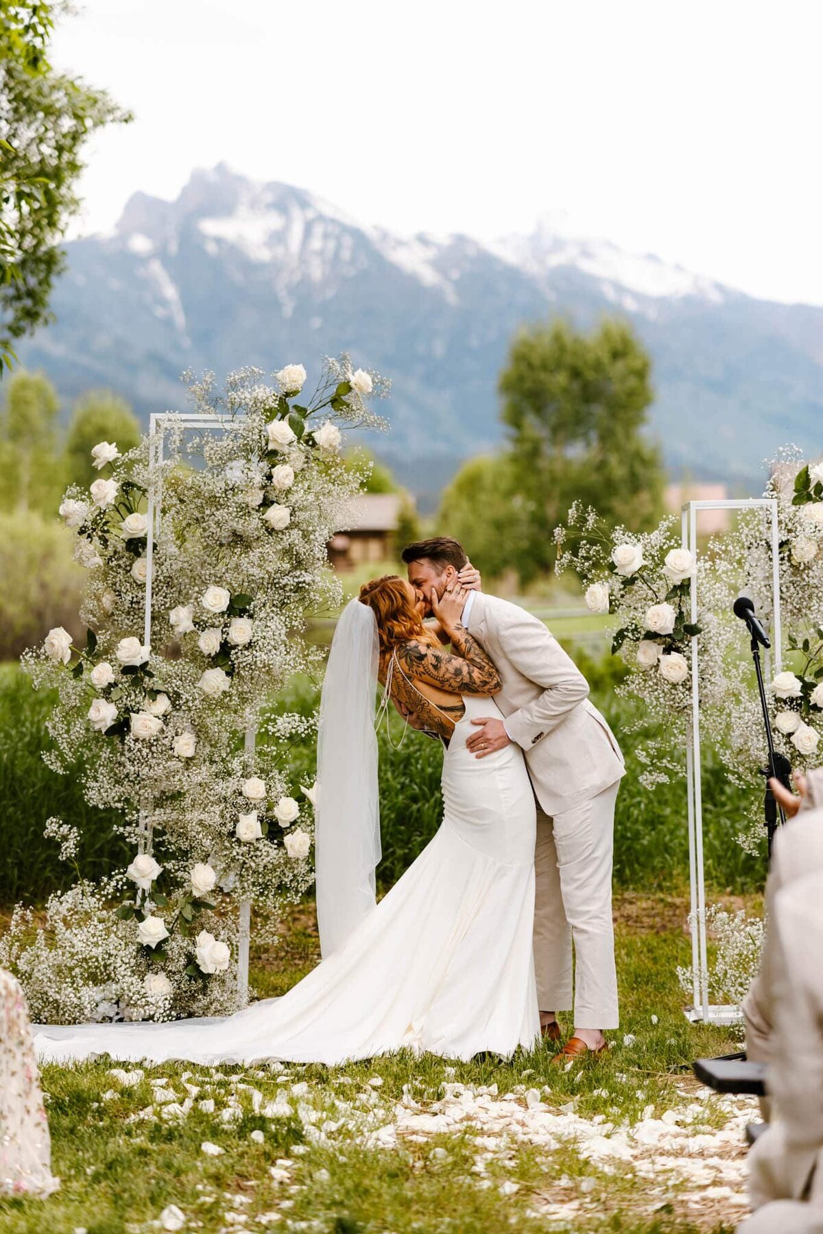 Couple kissing during luxury Jackson Hole wedding