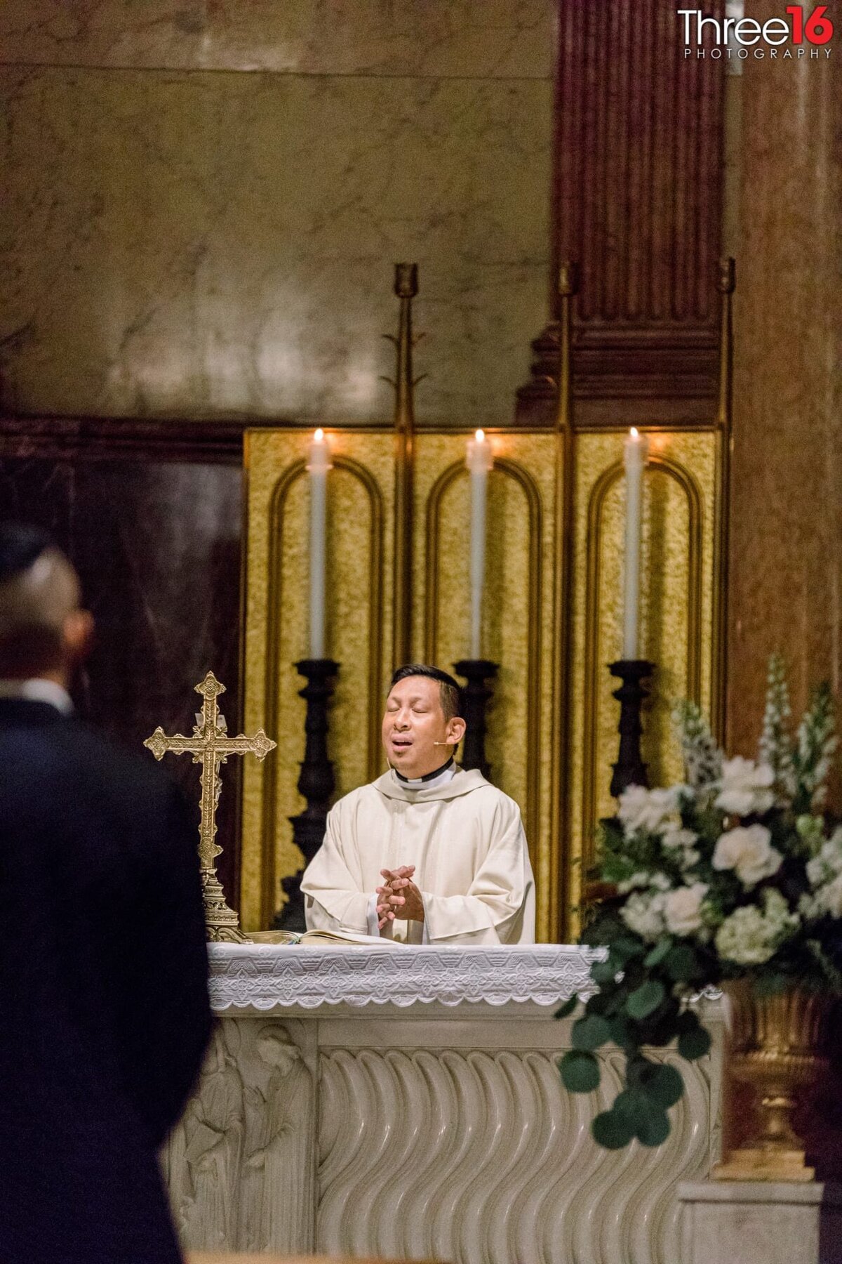 Priest speaks during a Catholic wedding ceremony