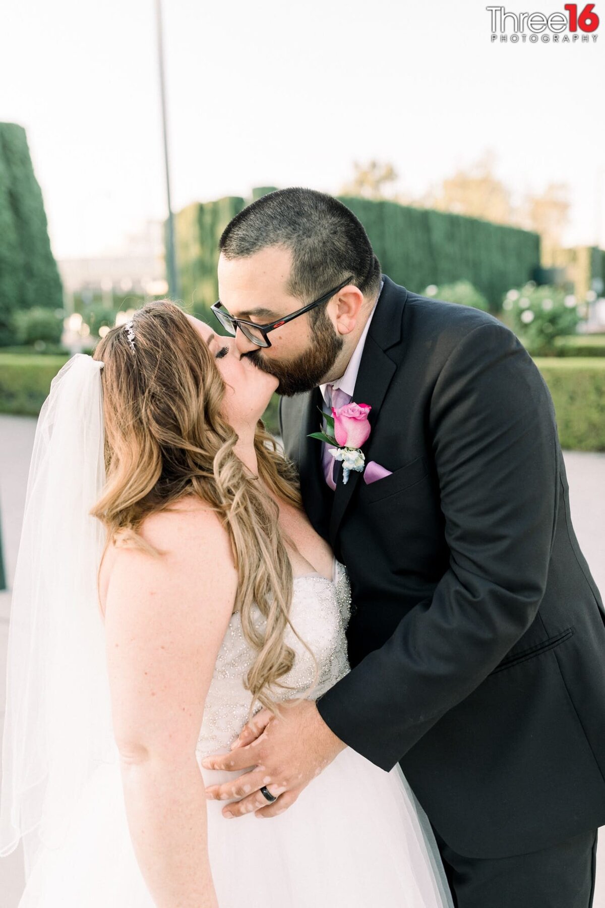 Bride and Groom engage in a romantic kiss after the wedding