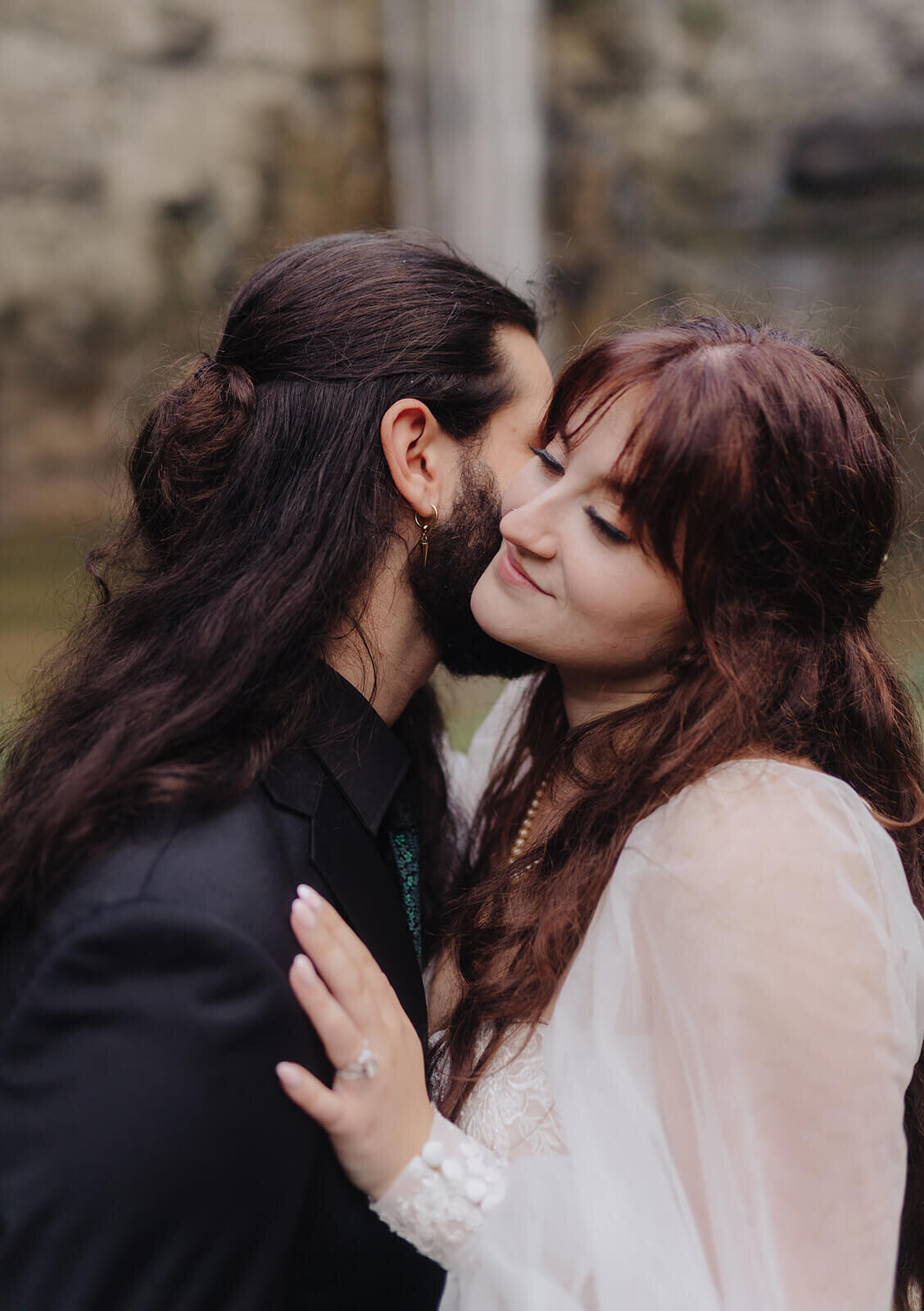 Bride and groom in front of waterfall at Finger Lakes wedding, NY