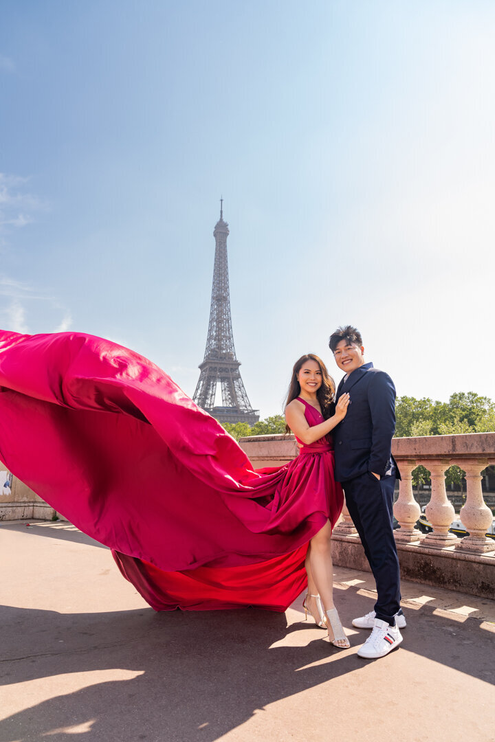 Pink flying dress couple portrait, Eiffel Tower backdrop, Paris photography session
