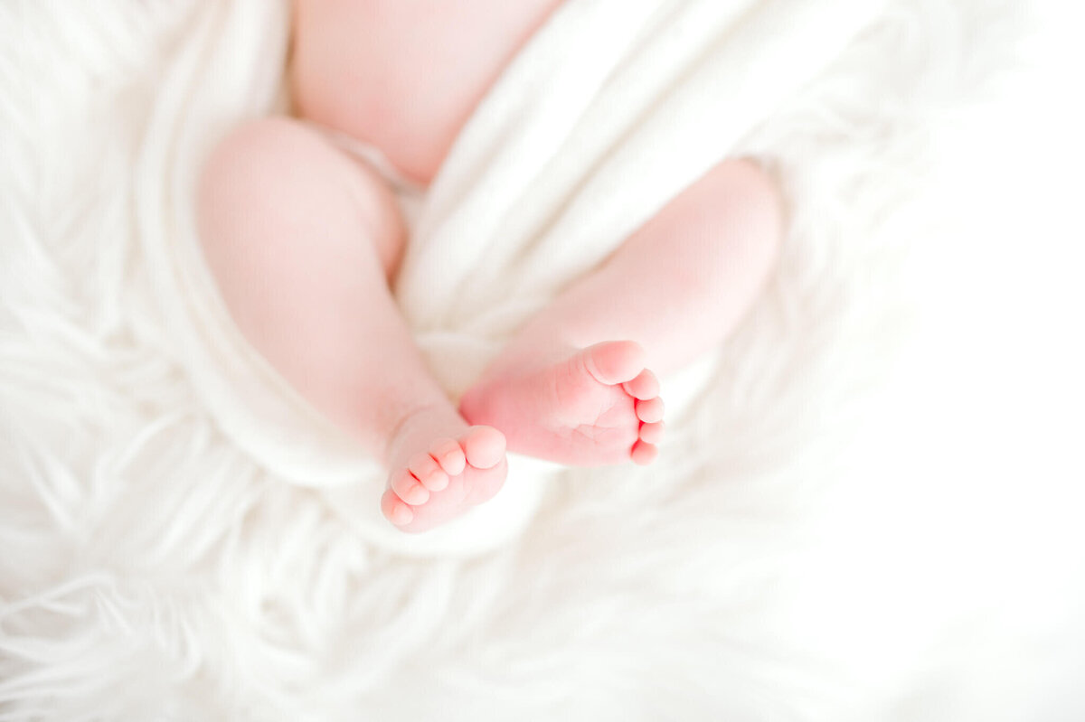 Newborn baby toes with everything else white