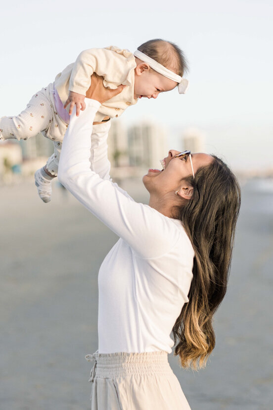 san-diego-family-portrait-mother-holding-up-daughter-Coronado-beach