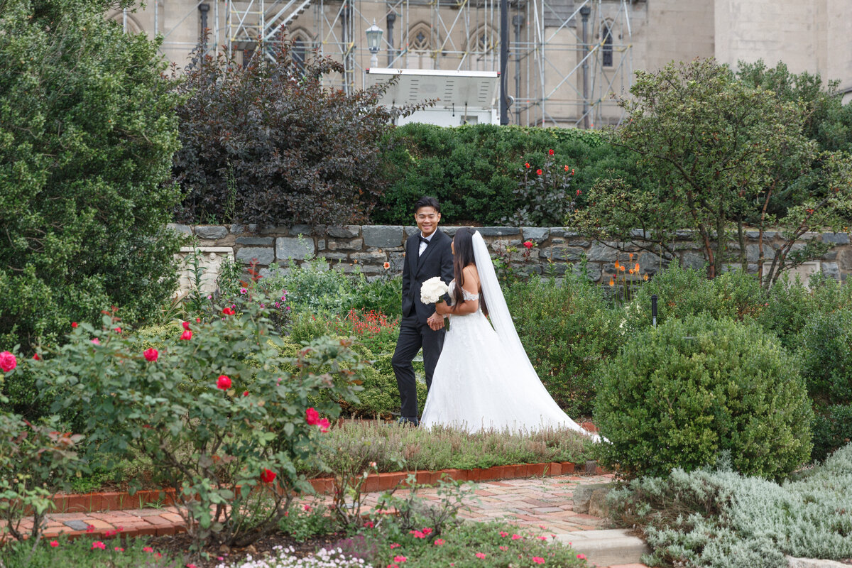 lovely bride and groom walking through an amazing garden wedding professional photographer Four Seasons Hotel Washington, DC