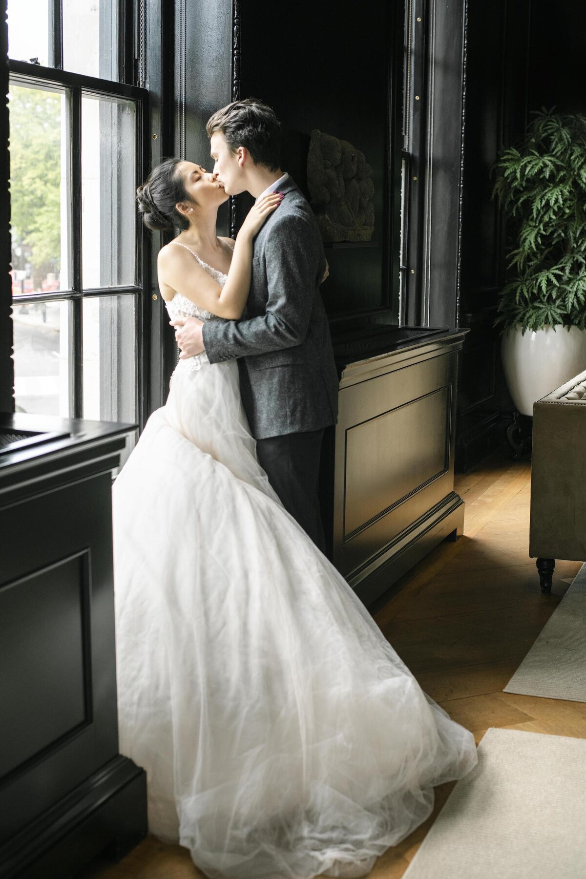 Brise and groom kissing