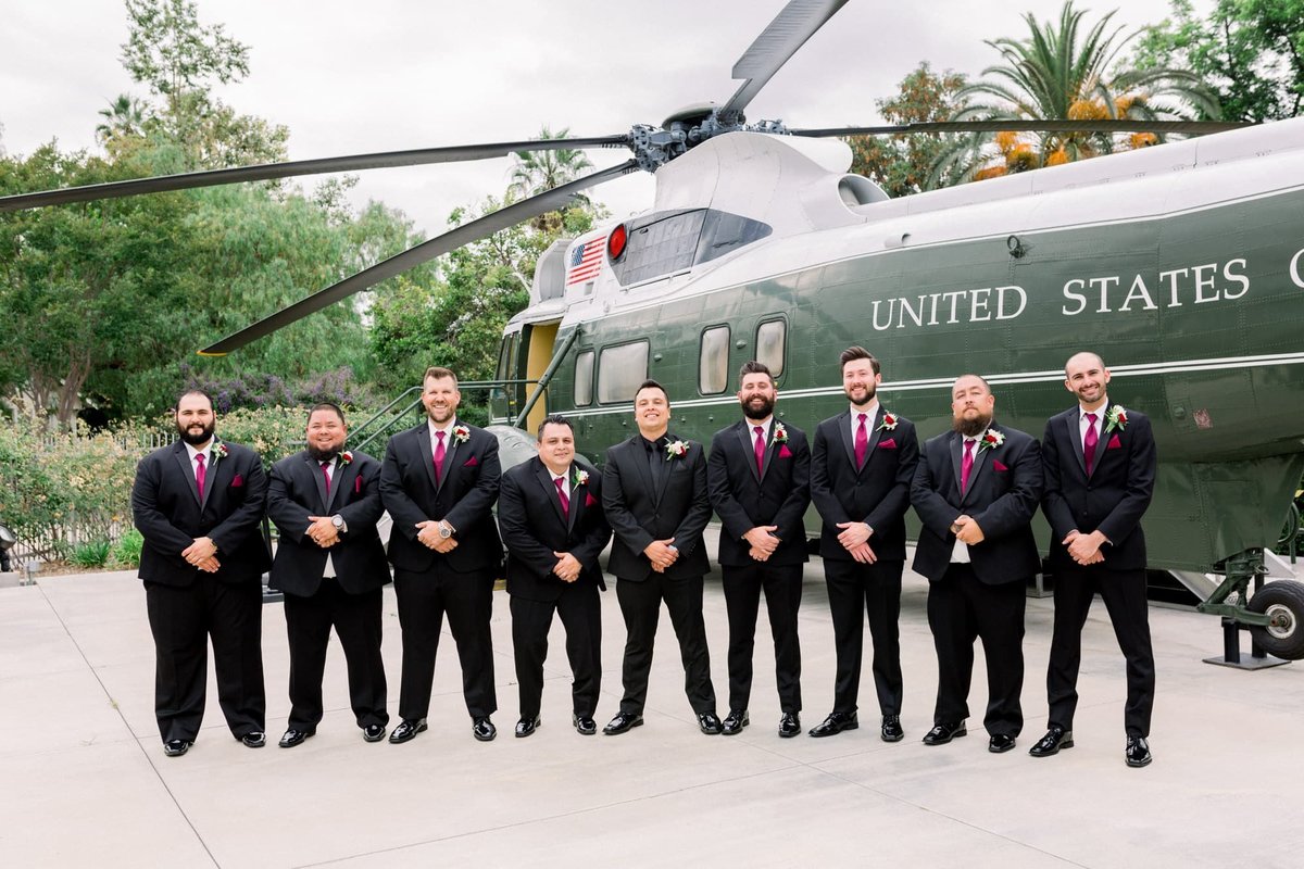 Groom and his groomsmen pose together in front of the US Helicopter located at the Richard Nixon Presidential Library