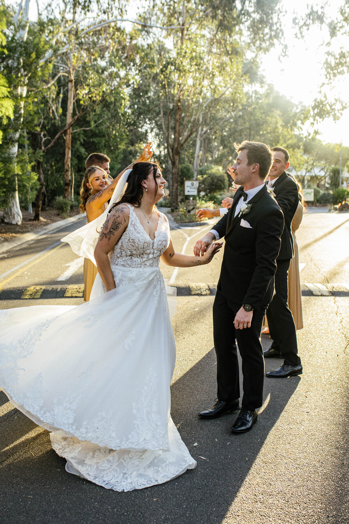 The bride and groom finished their dance as the bridal party cheered them on during sunset. 