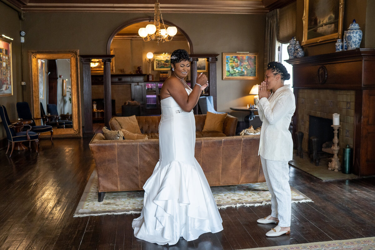 Brides see each other for the first time during their first emotional look before their ceremony.
