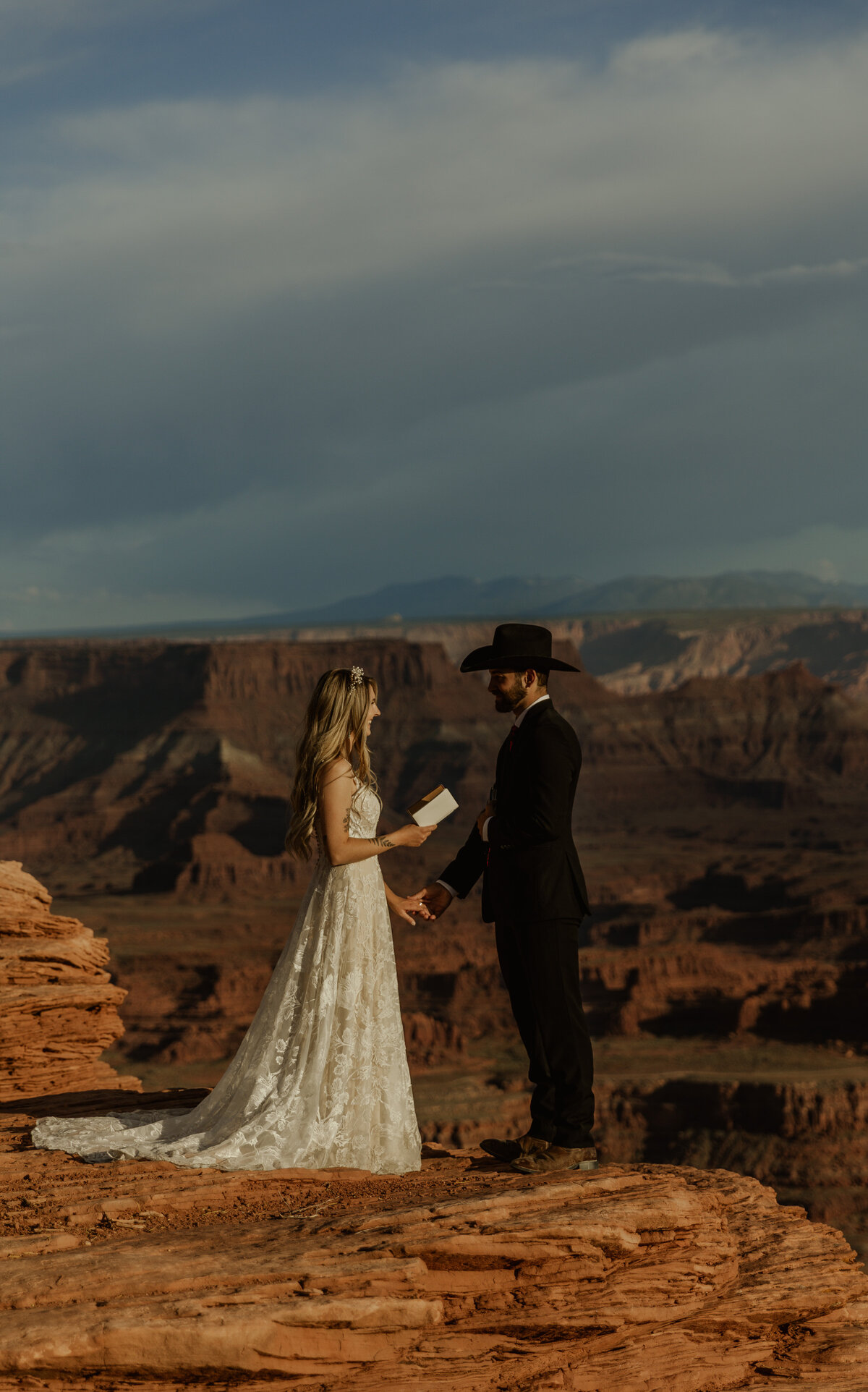 Cliffside elopement at Dead Horse Point in Moab Utah at Sunset vow reading