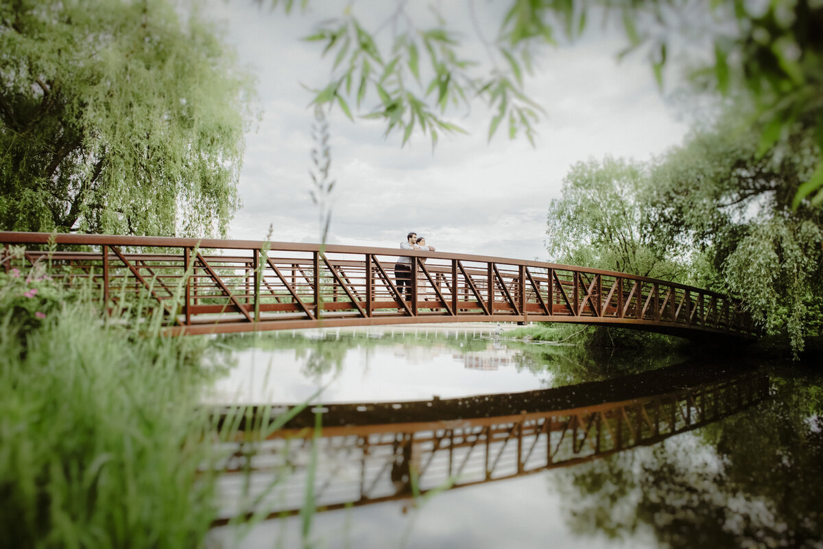 couple-relaxing-on-a-bridge-at-the-ottawa-arboretum-1
