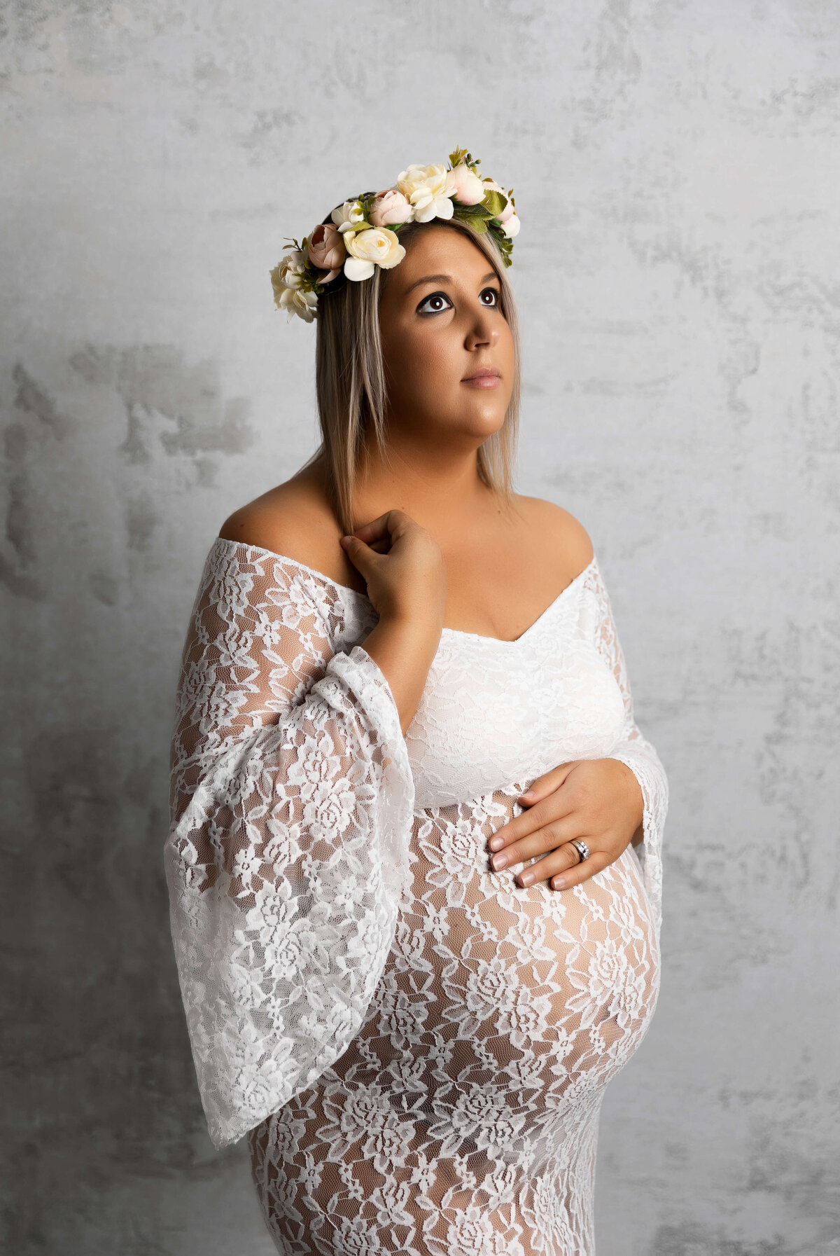 Young mother in a lace dress in an Erie PA photography studio