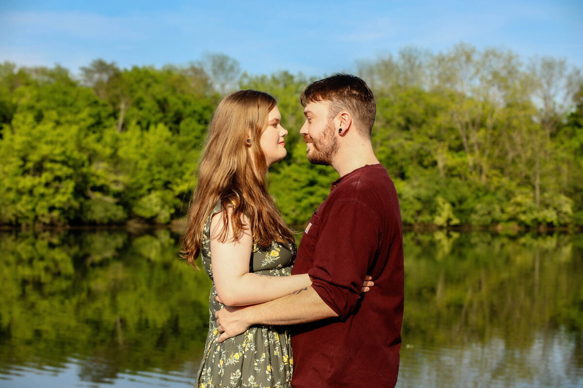 Engagement-Photo-Session-Couple-Kissing--next-to-water