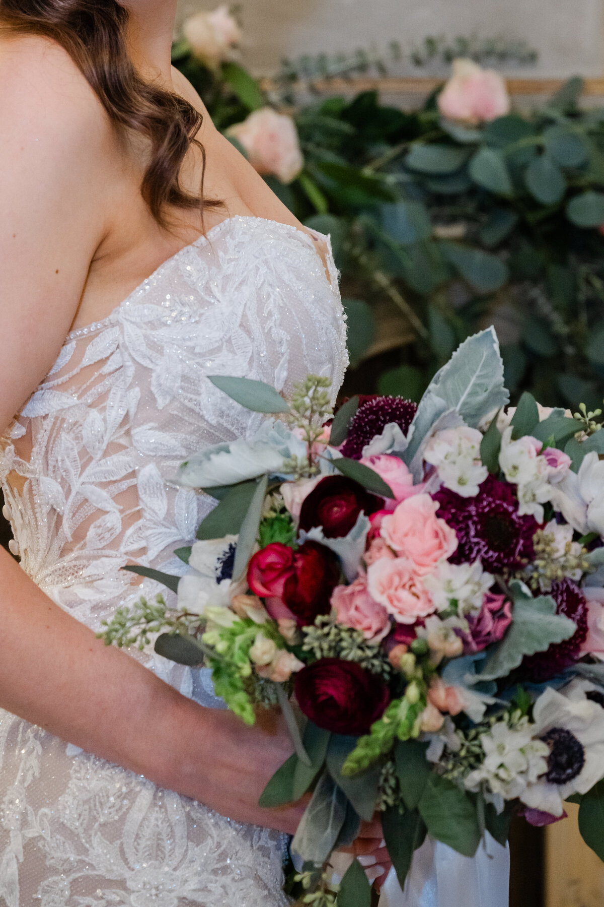 bridal details lace dress with bright bouquet