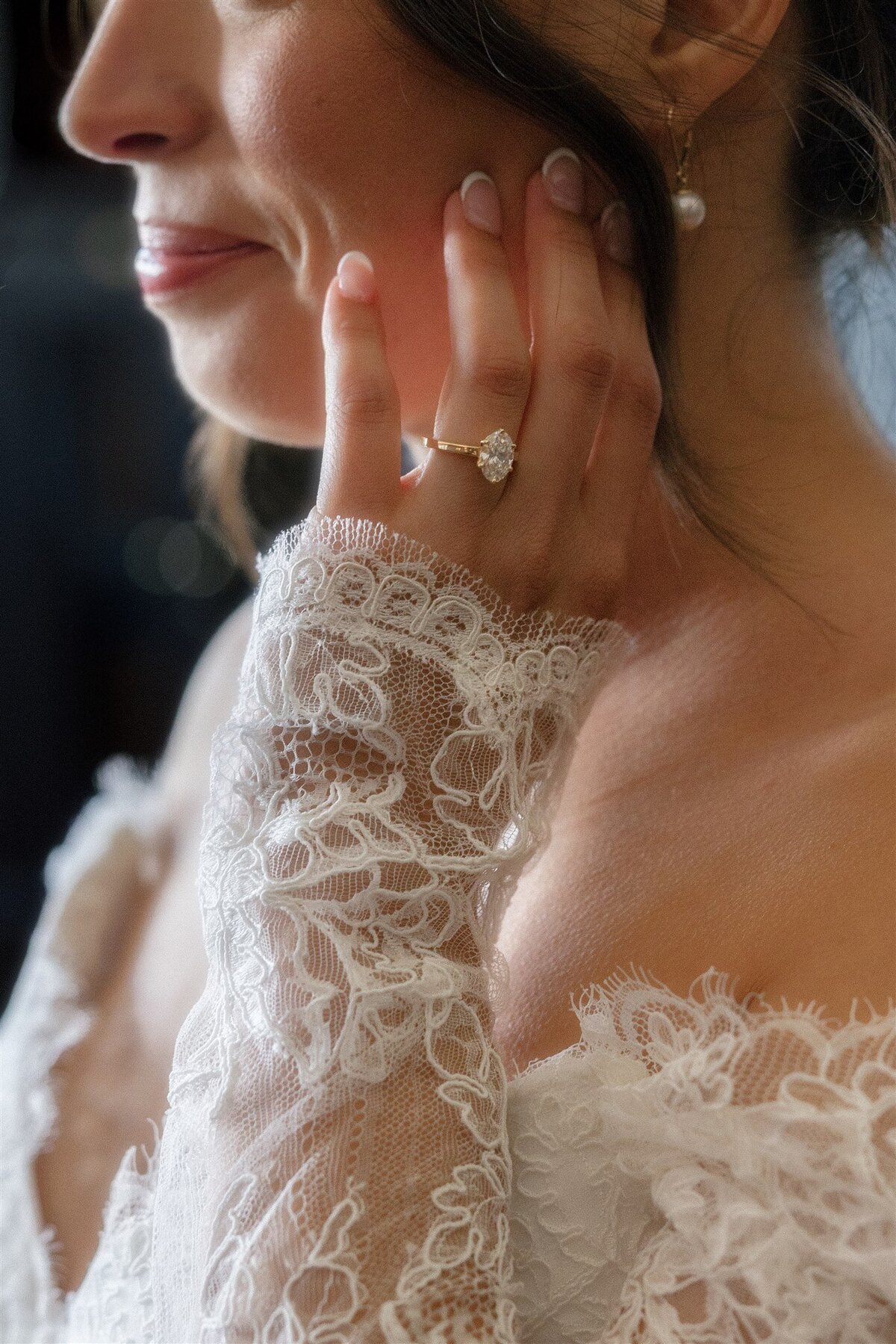 Close up details of engagement ring on brides hand during wedding at the Santa Barbara Club