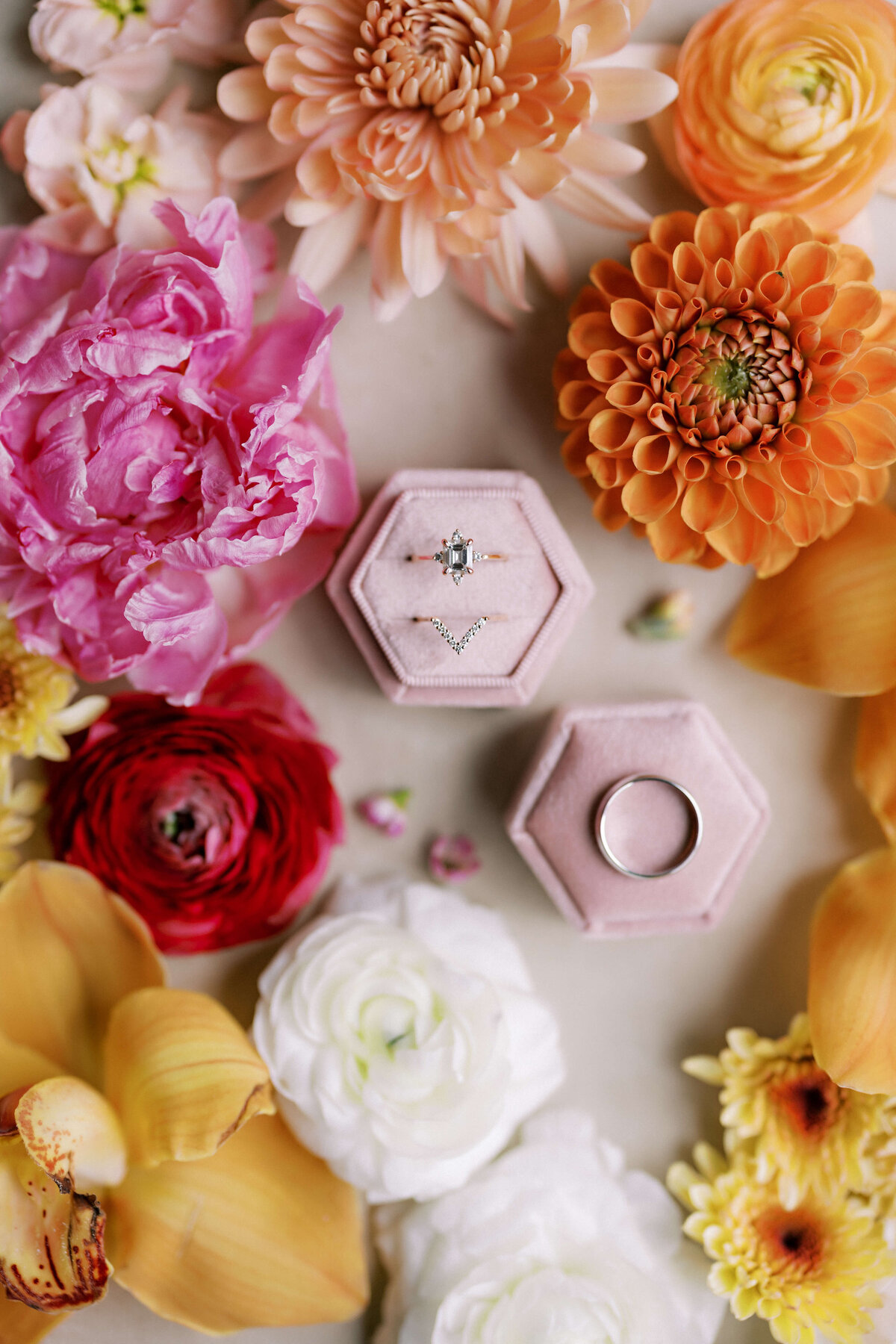 Colorful flowers and a blush ring box