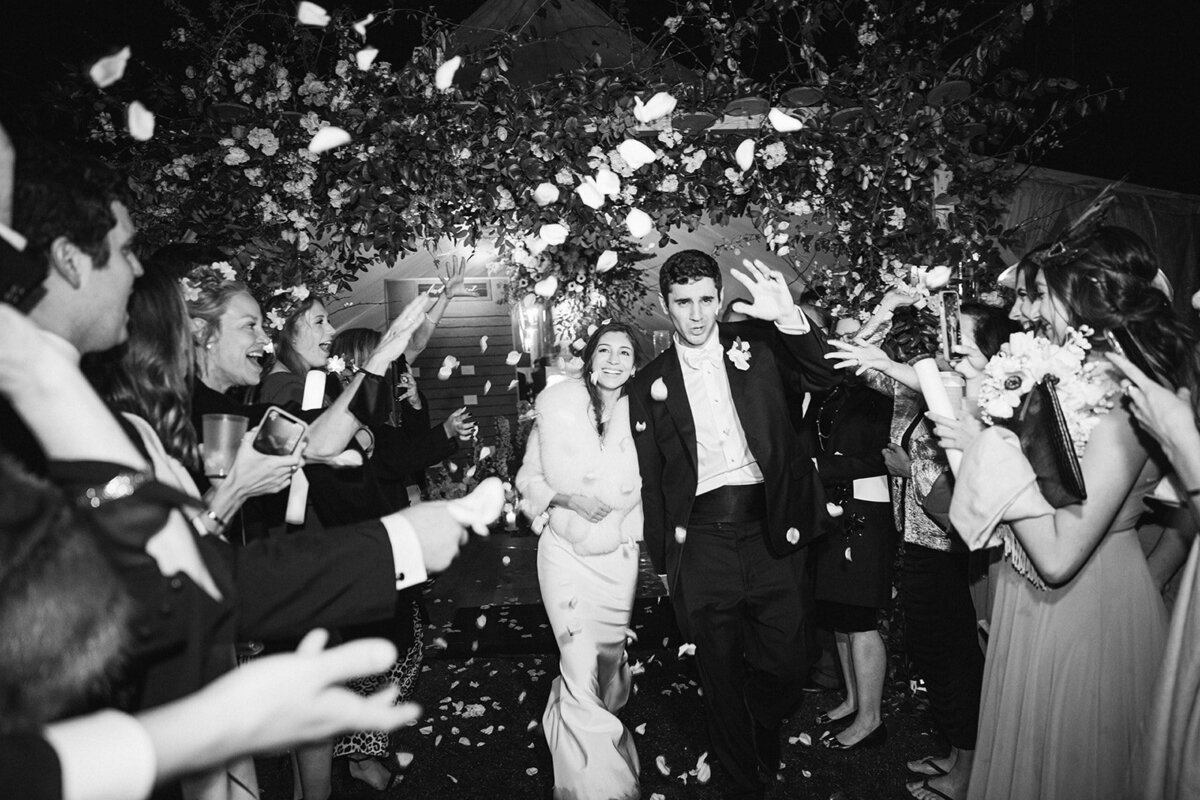 bride-groom-tented-wedding-exit-petals
