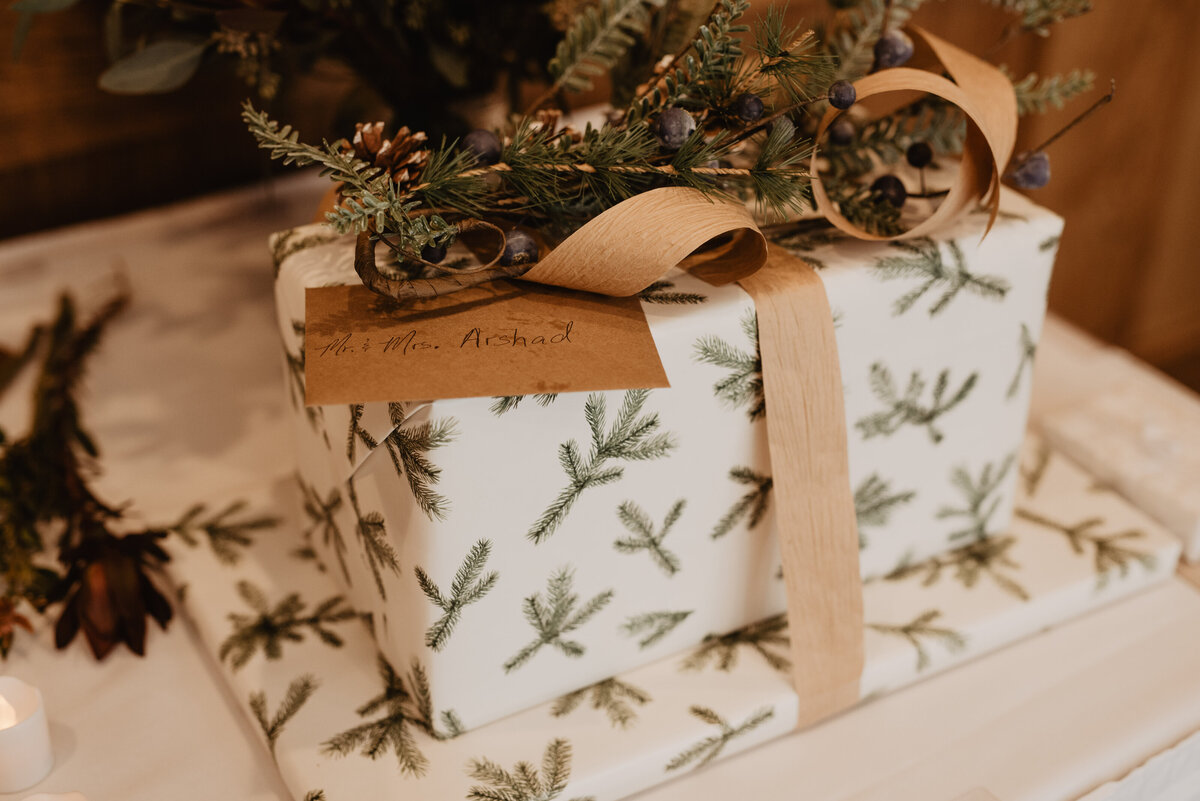 Photographers Jackson Hole capture wedding gifts with pine needle wrapping paper