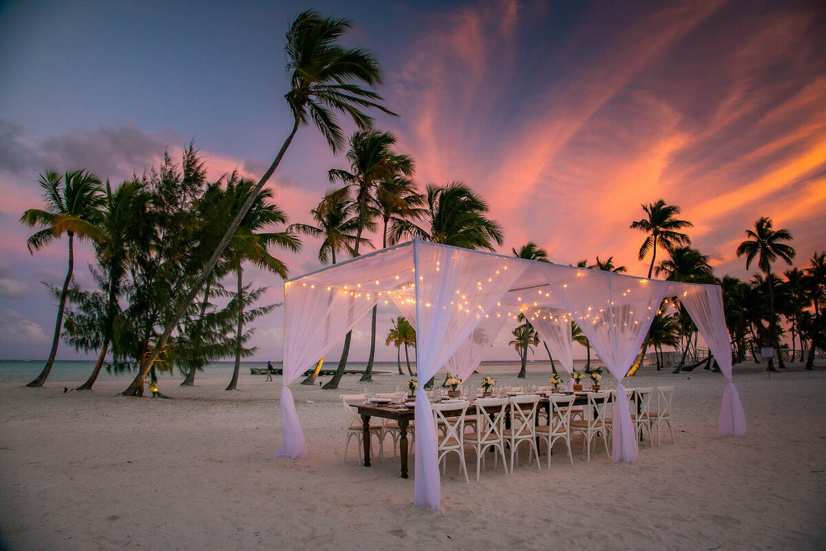 wedding table on the beach at sunset