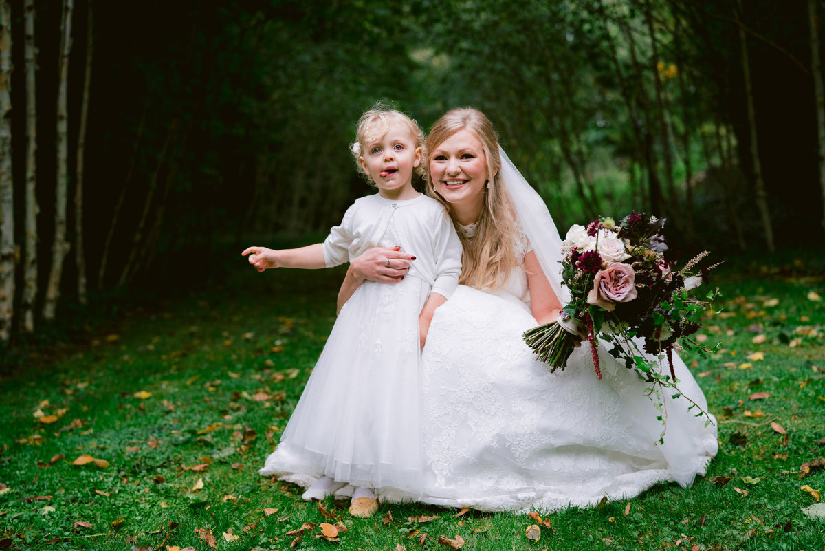 a cute photo of the bride and her flower girl taken at cripps barn