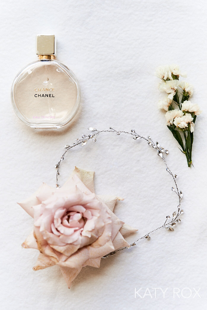 Details of the bride perfume, florals, headpiece