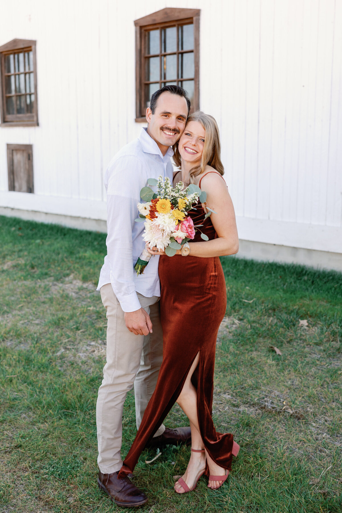 Bridesmaids in mismatched rust velvet gowns holding autumn-inspired bouquets at Maryland barn wedding.