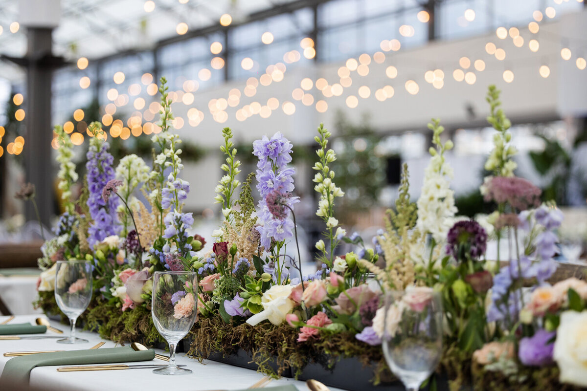 Garden themed wedding reception with caramel, sage and purple tones.