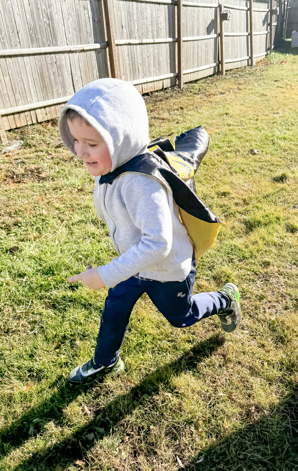 Student running across the playground at House of Parker Preschool in Gorham Maine where we believe that play isn’t just something children do—it’s how they learn. 